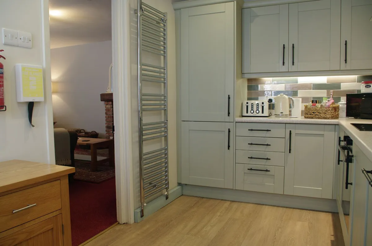 Kitchen with lounge beyond